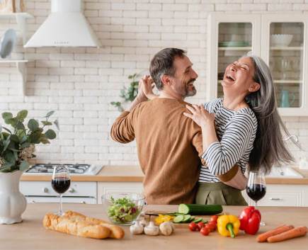 Happy couple dancing in the kitchen