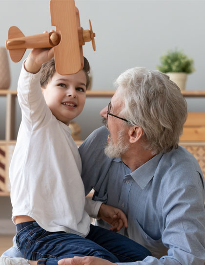 grandfather and grandson with toy plane